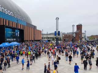 Thousands of fans gather outside the Hill Dickinson stadium in the fan plaza before starting the Everton 10k.