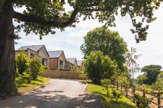 An image of the new builds at Standish Hospital Estate and the drive leading up to them