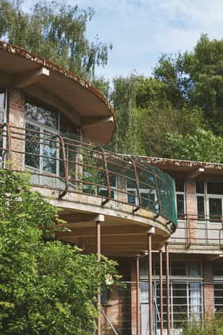An image of Standish hospital unoccupied, nature is coming back through the building